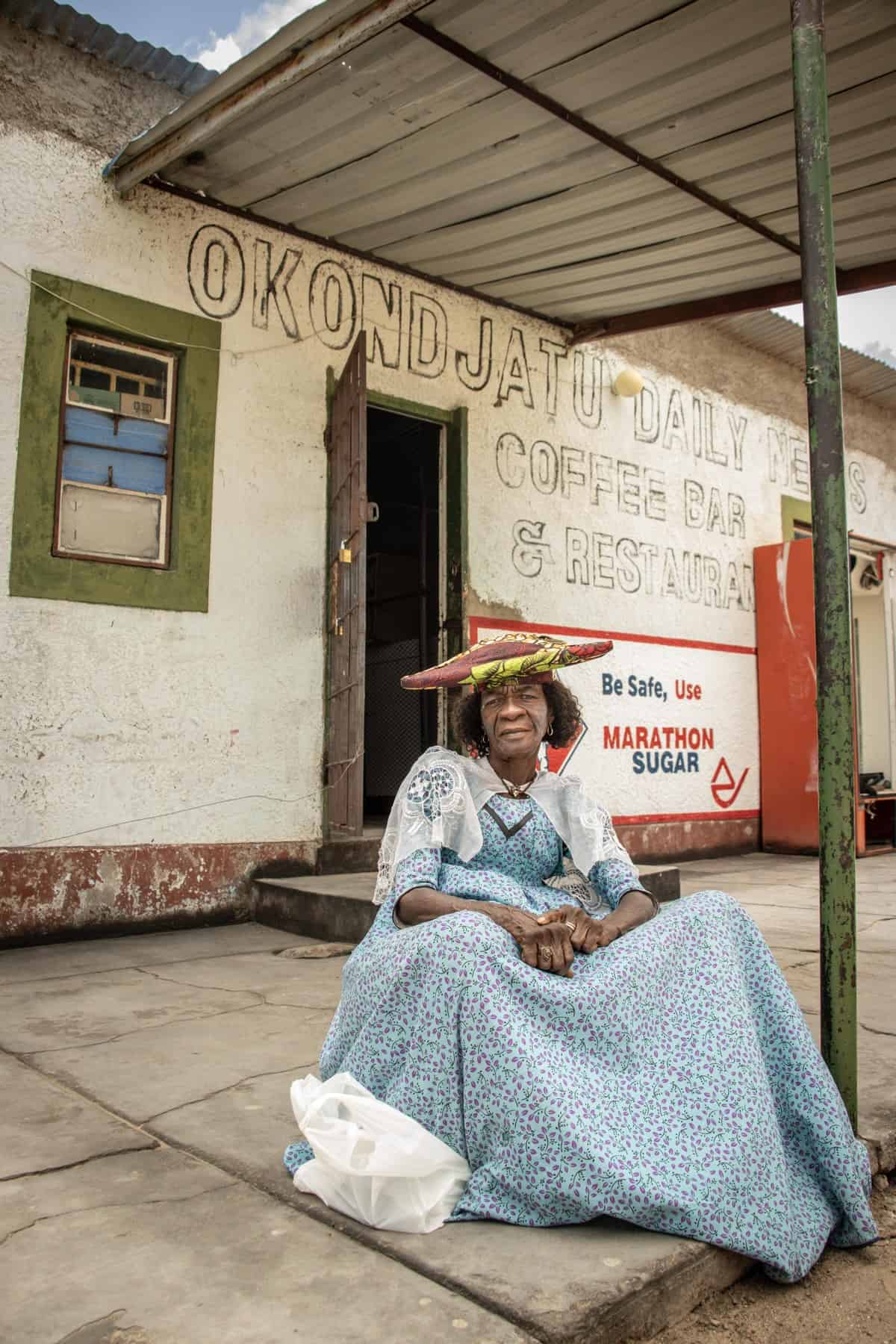 A community member outside a shop in Okondjatu